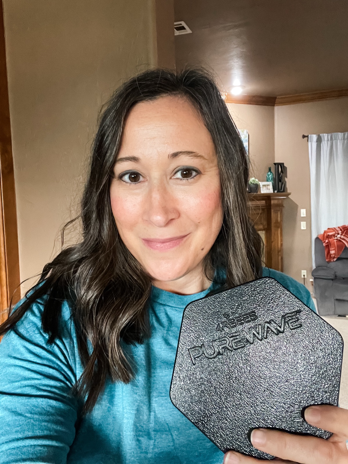 Kari holding the hexagonal PureWave Cell magnet